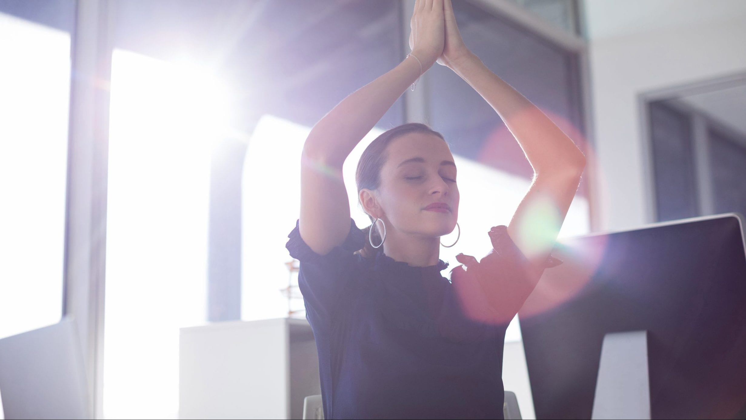 Woman doing chair yoga