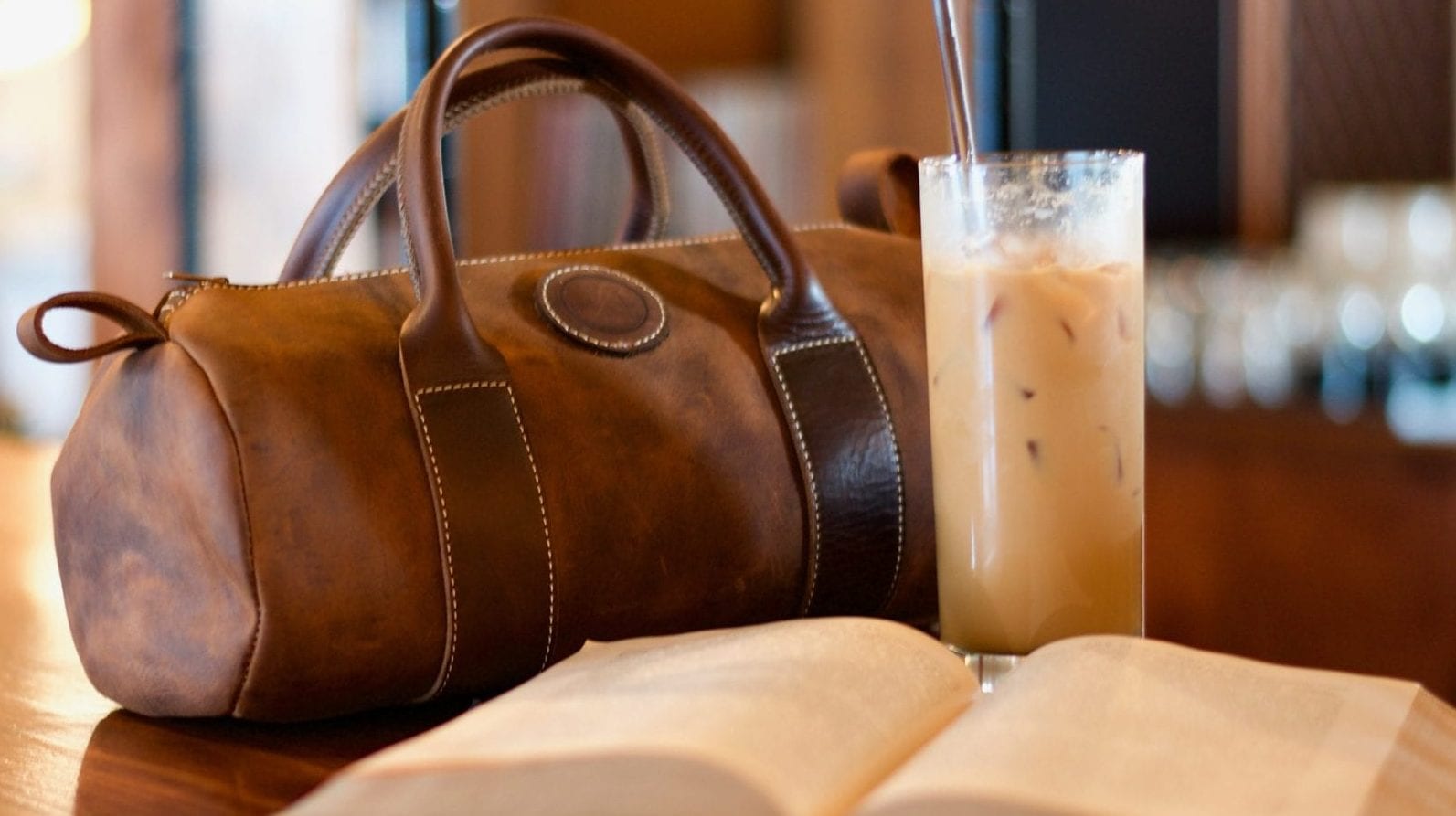 book glass of iced coffee